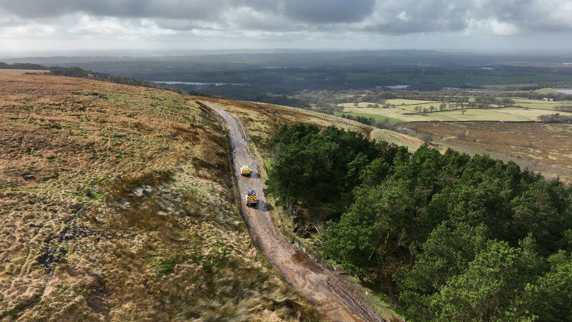 Mountain Rescue Ambulance Vehicles Driving Across Rugged Terrain
