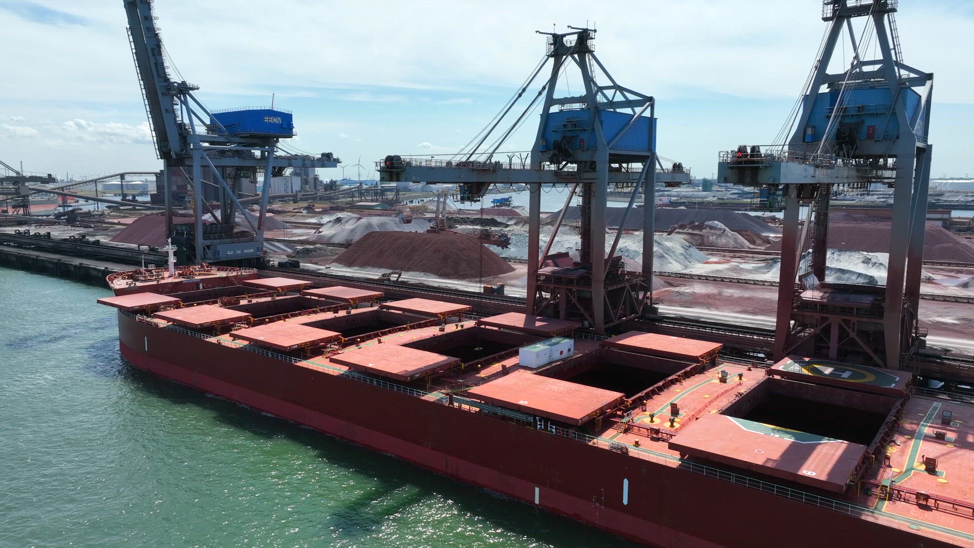 Bulk Carrier Ship Offloading Cargo By Crane for Processing