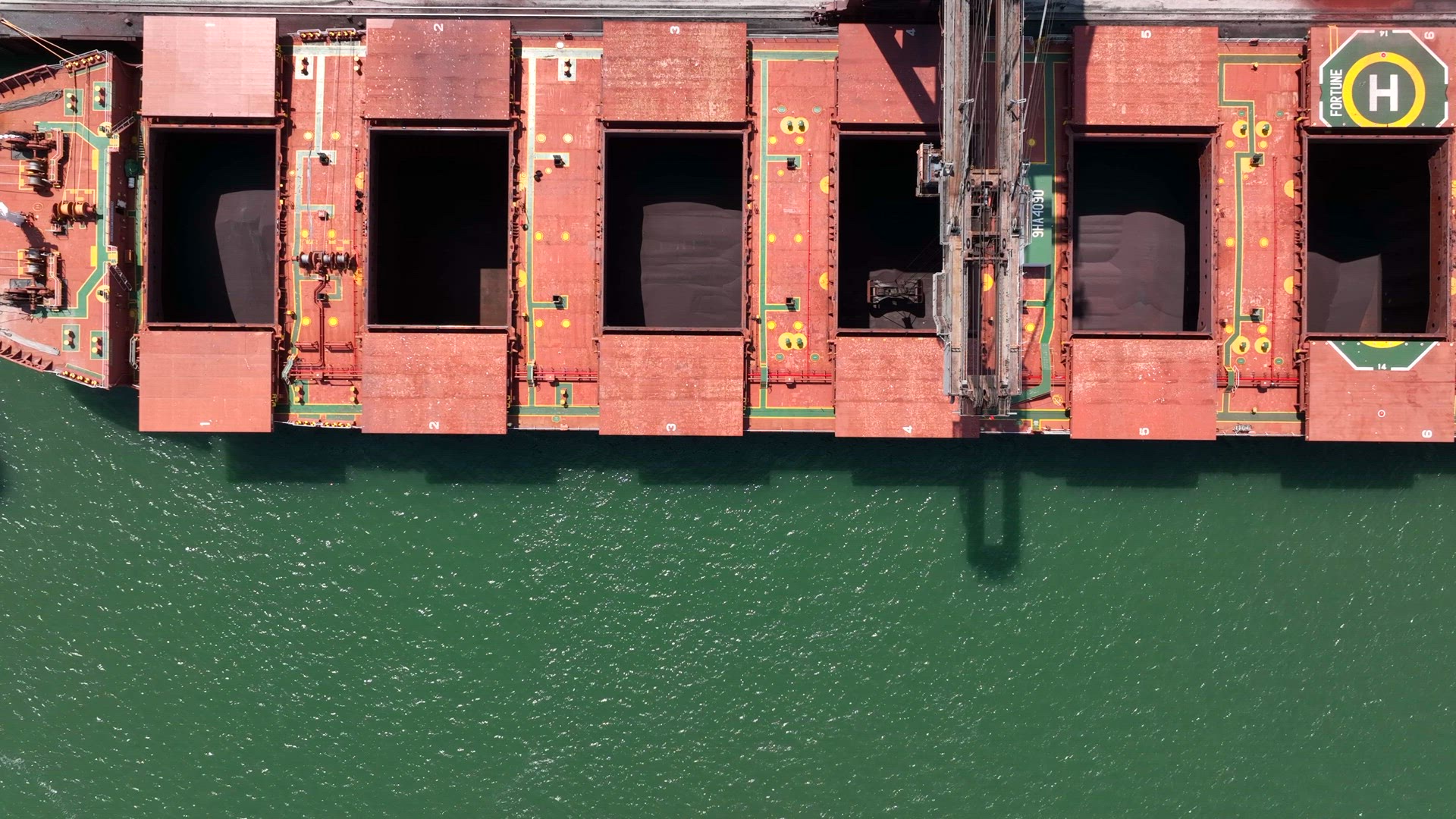 Bird's Eye View of a Bulk Carrier Ship Being Unloaded