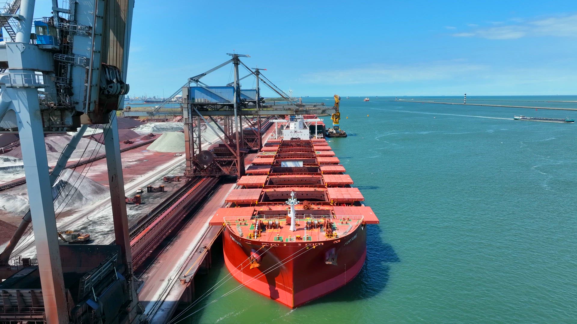 Bulk Carrier Ship Offloading Cargo By Crane for Processing