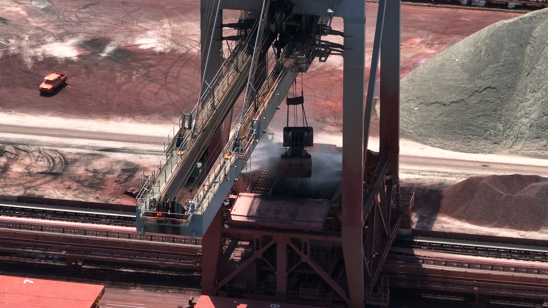 Cranes Unloading a Bulk Carrier at Port