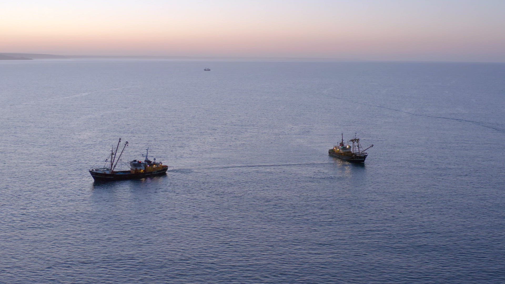 Fishing Trawlers at Sunrise Seen From the Air