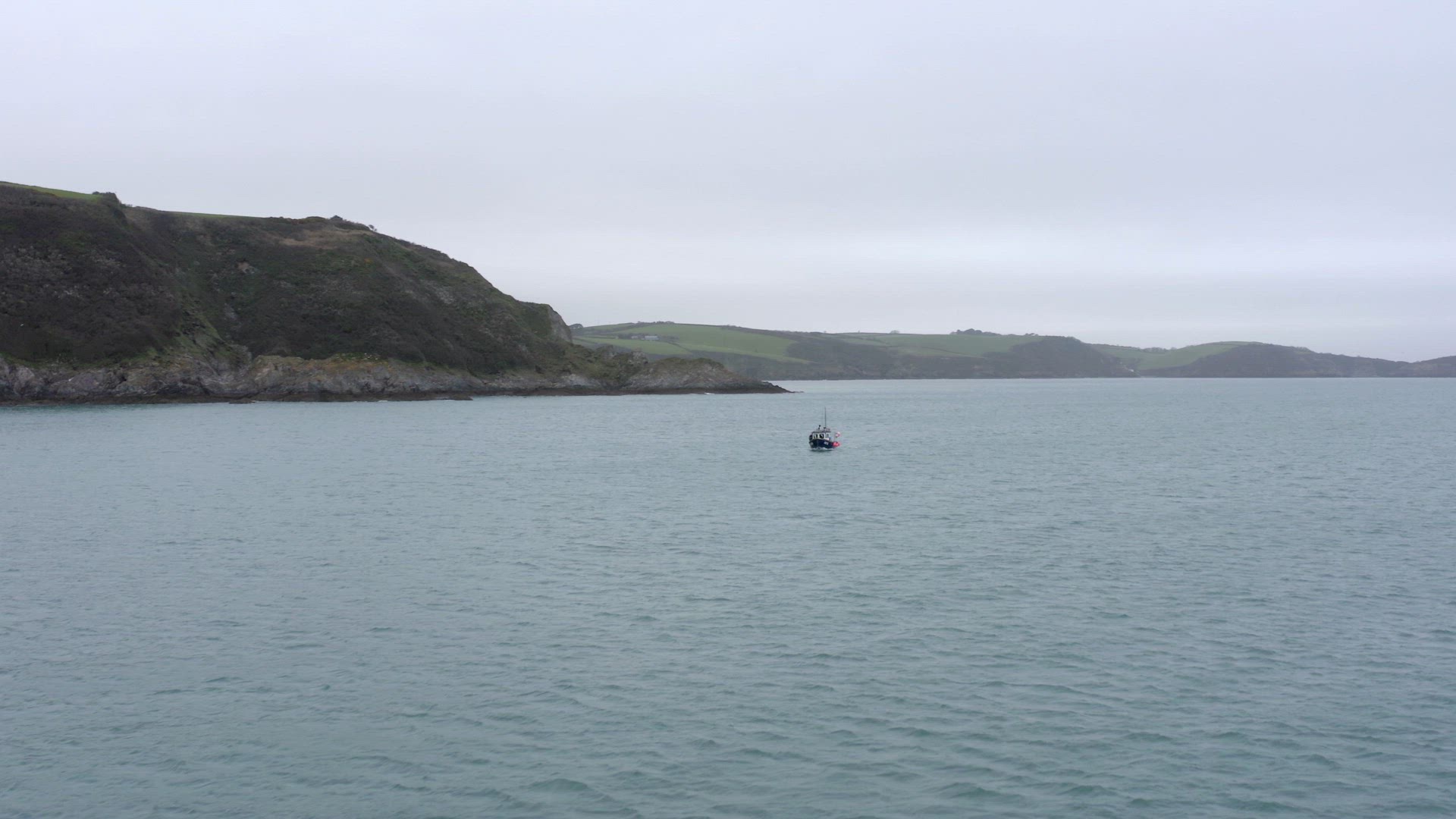 Fishing Boat on a Grey Day Out Catching Fish Aerial View