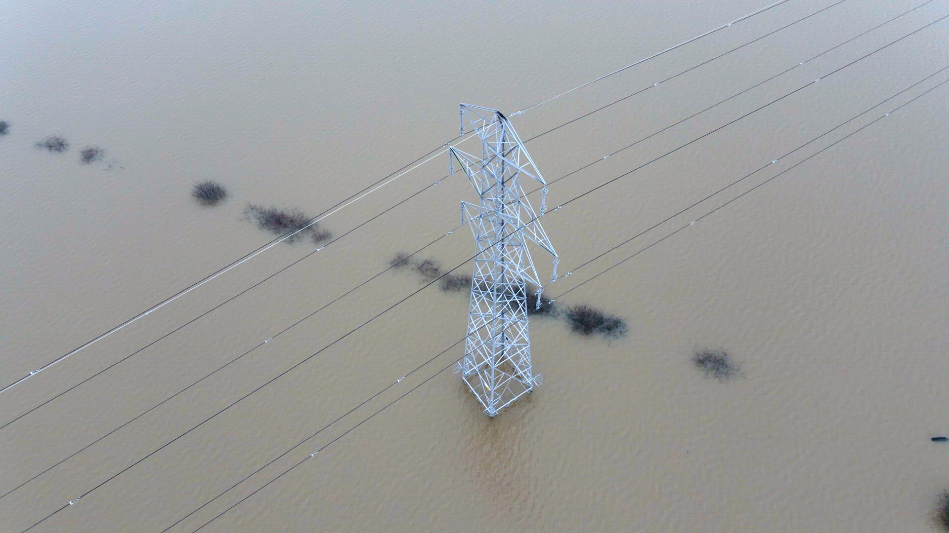 An Electricity Pylon in Deep Water in a Floodwaters Causing Power Cuts