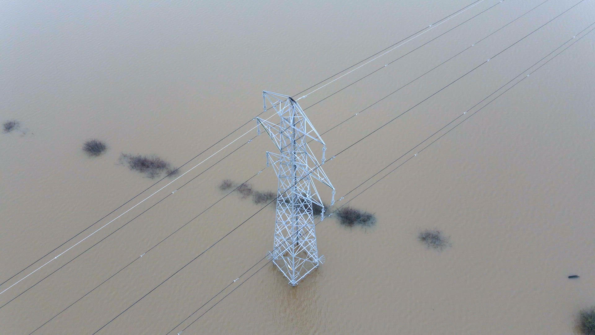 An Electricity Pylon in Deep Water in a Floodwaters Causing Power Cuts