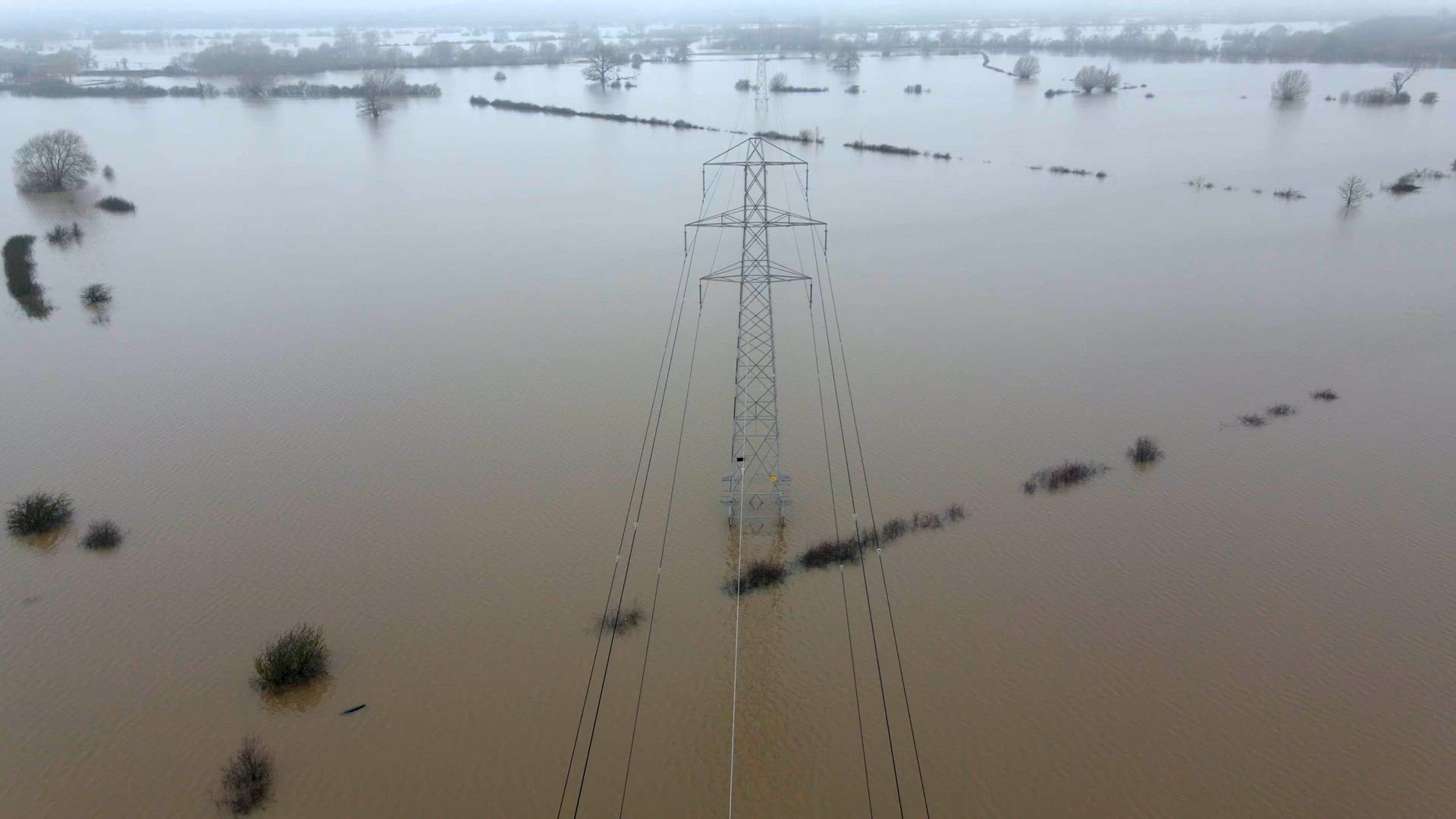 An Electricity Pylon in Deep Water in a Floodwaters Causing Power Outages