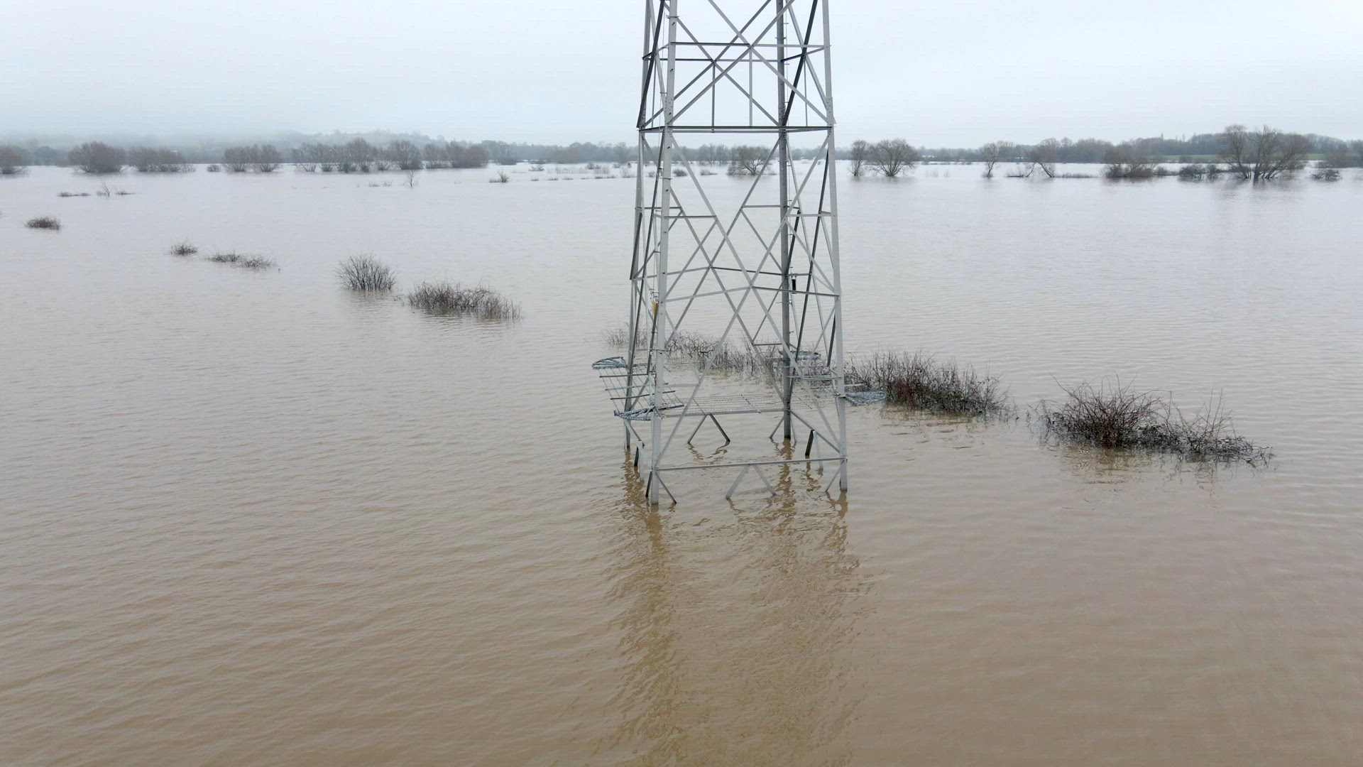 An Electricity Pylon in Deep Water in a Floodwaters Causing Power Outages