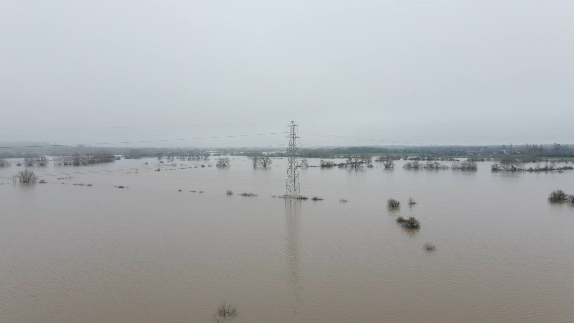An Electricity Pylon in Deep Water in a Floodwaters Causing Power Outages