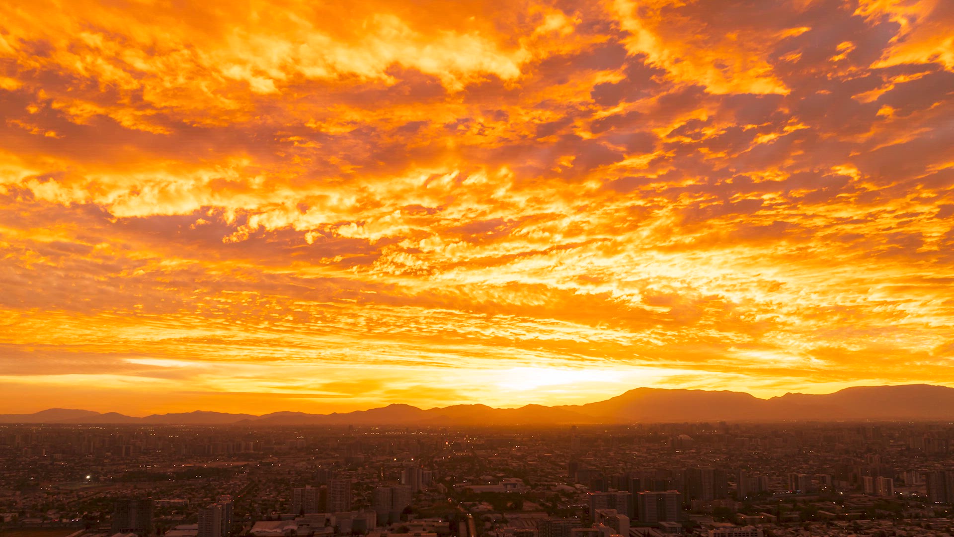 Beautiful sunset colors in the clouds over the Capital of Chile