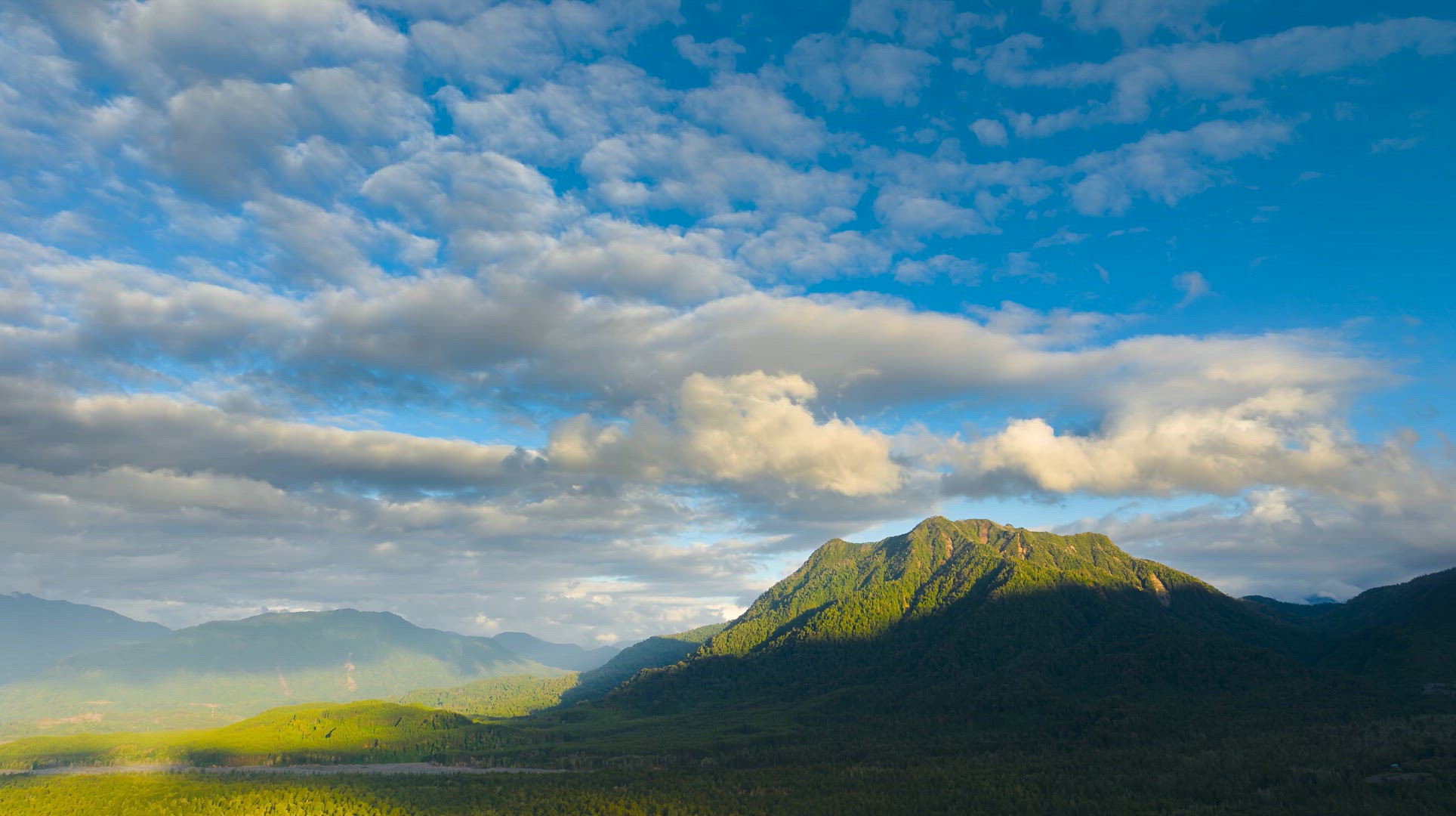 Clouds Over Andes Mountains Covered With Native Forest