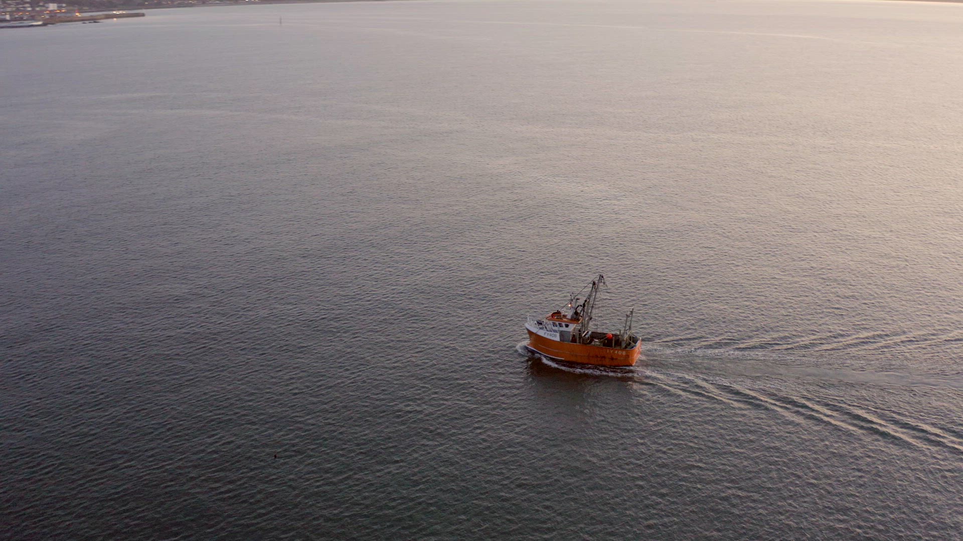 Fishing Boat at Sunrise out at Sea