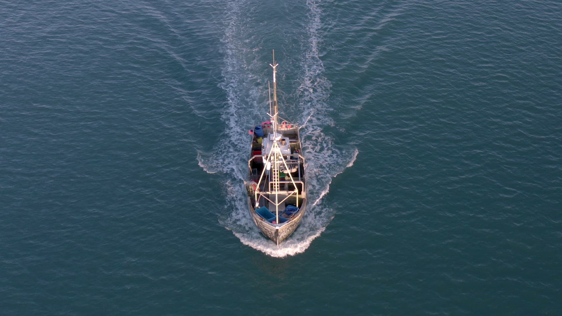 Fishing Boat in the Early Morning Heading Out to Sea