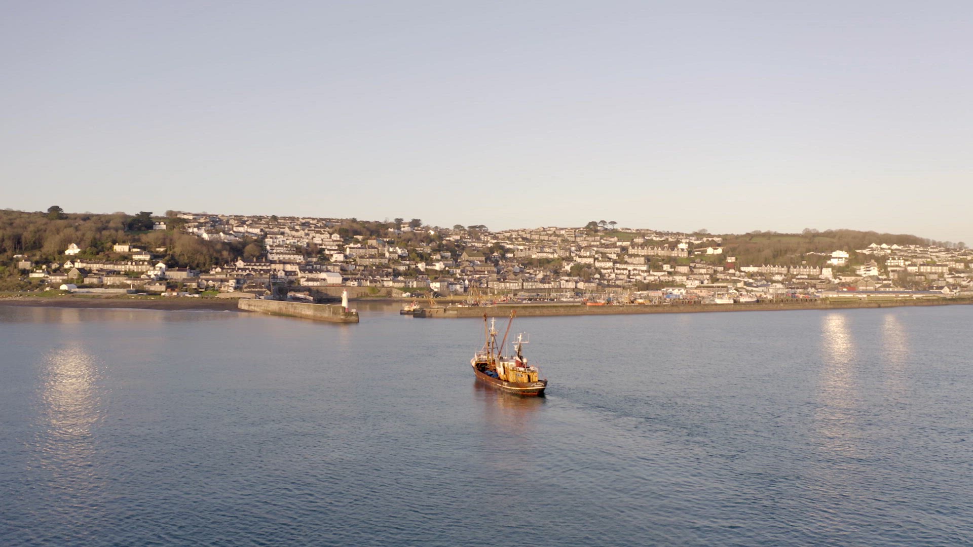 Fishing Boat Returning to Port at Sunrise