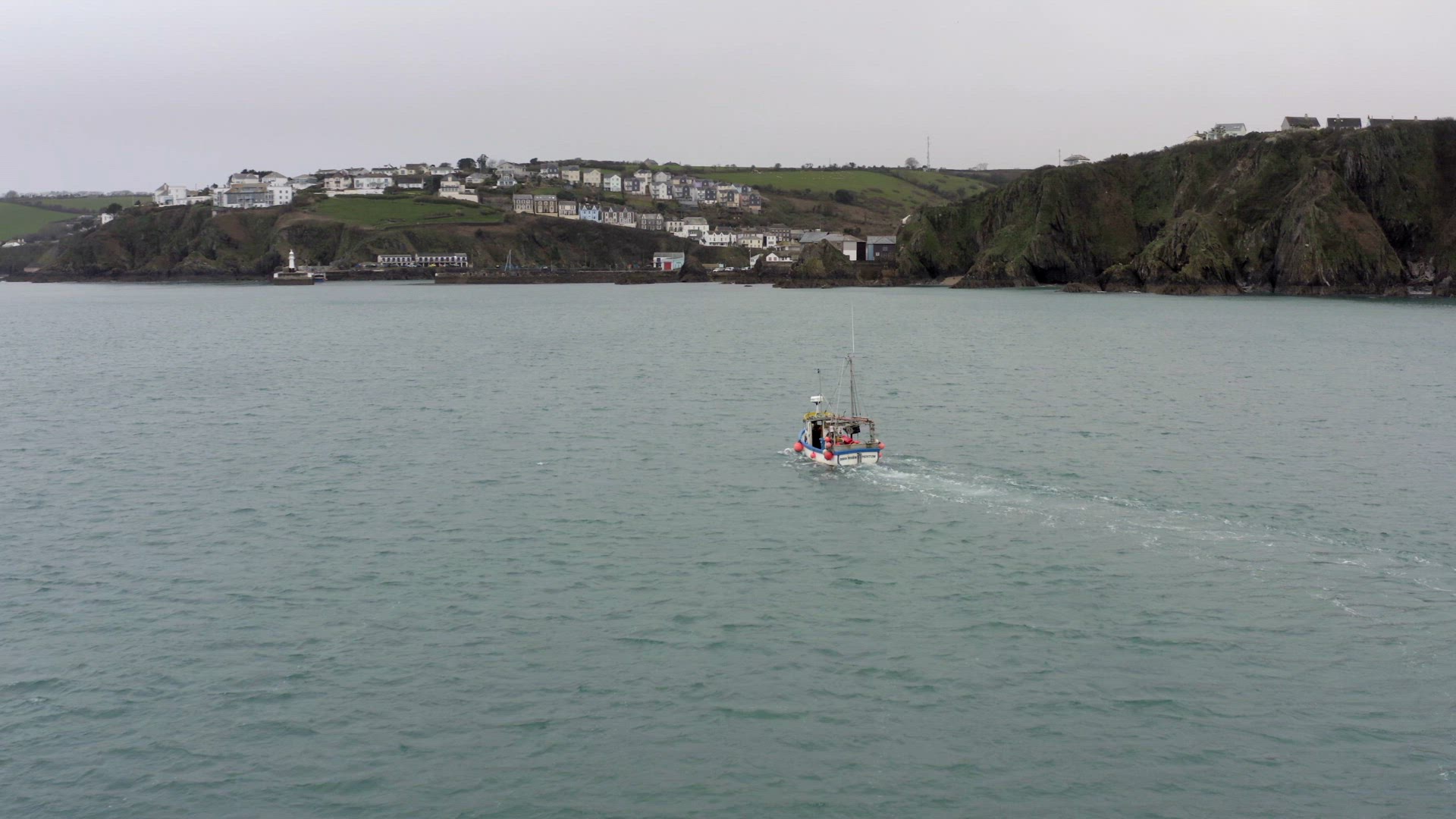 Fishing Boat on a Grey Day Out Catching Fish Aerial View