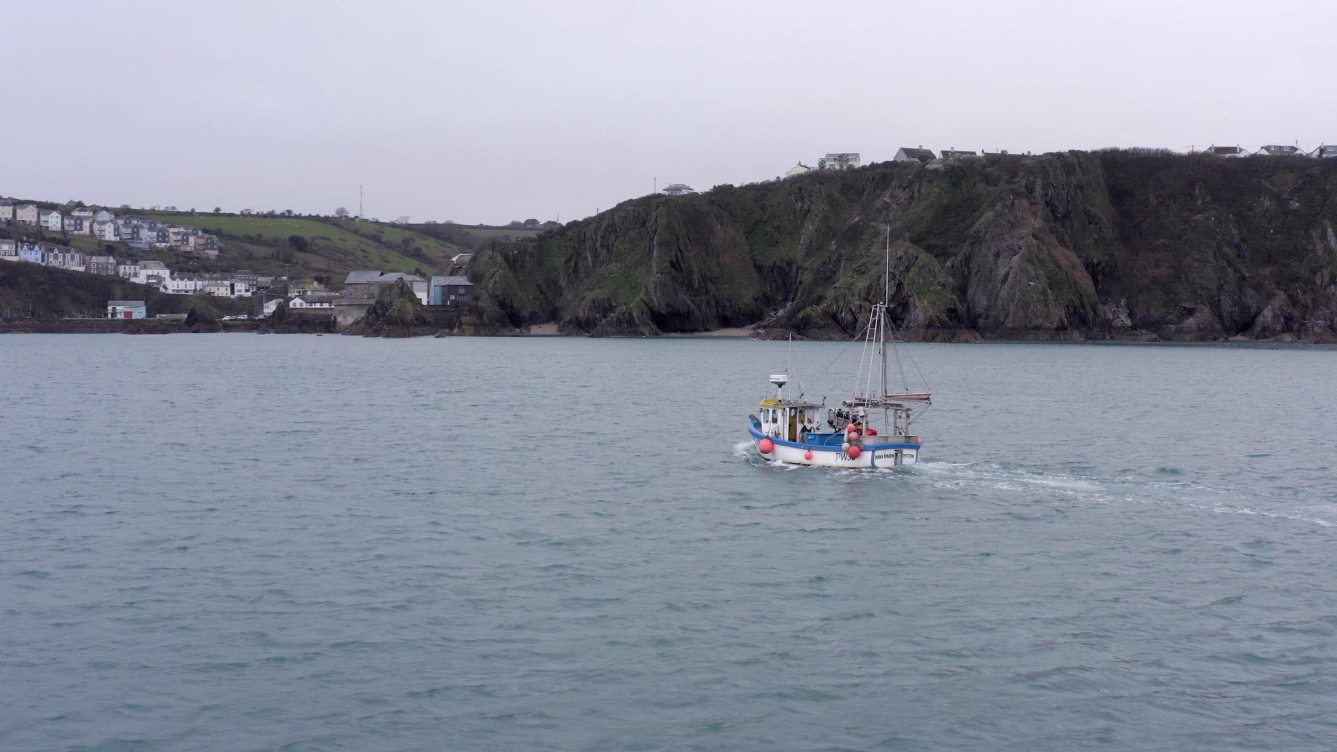 Fishing Boat on a Grey Day Out Catching Fish Aerial View