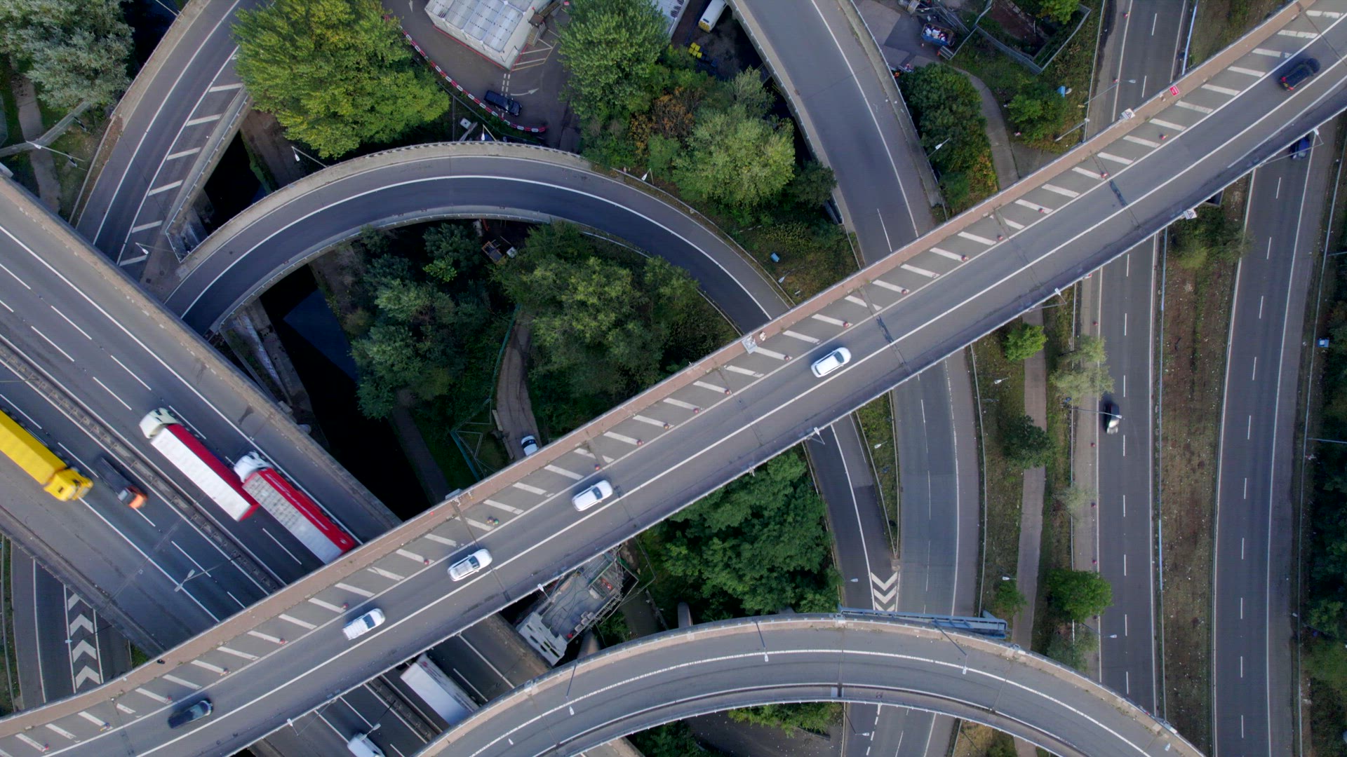 Vehicles Driving on a Spaghetti Interchange Bird's Eye Aerial View