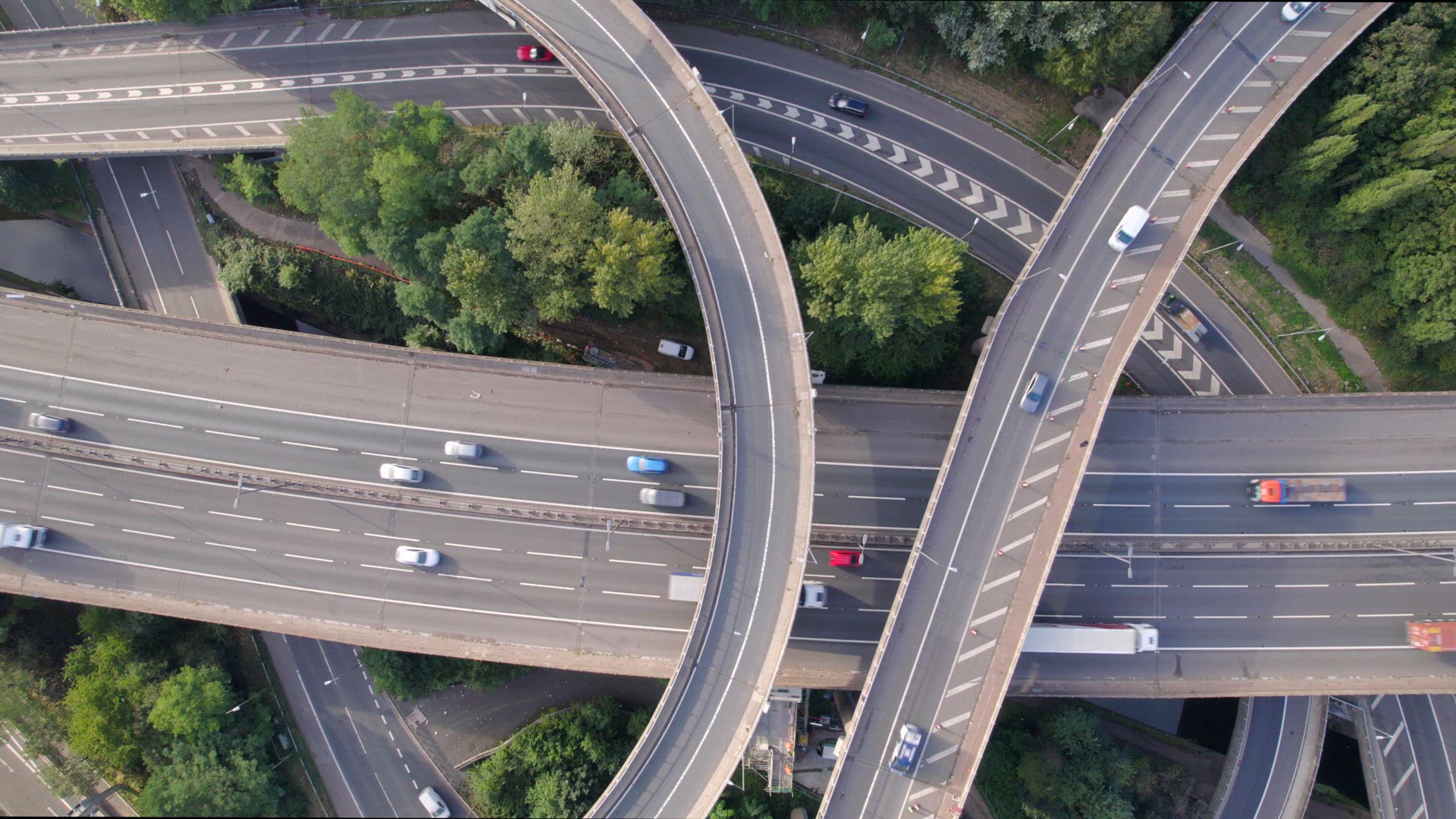 Vehicles Driving Through a Mixing Bowl Interchange Aerial View