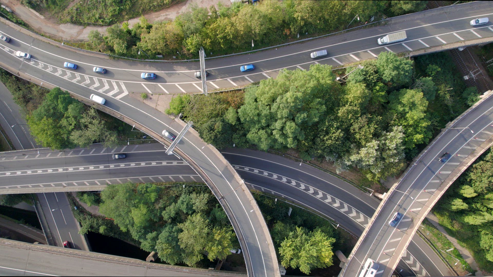 Vehicles Driving Through a Mixing Bowl Interchange Aerial View