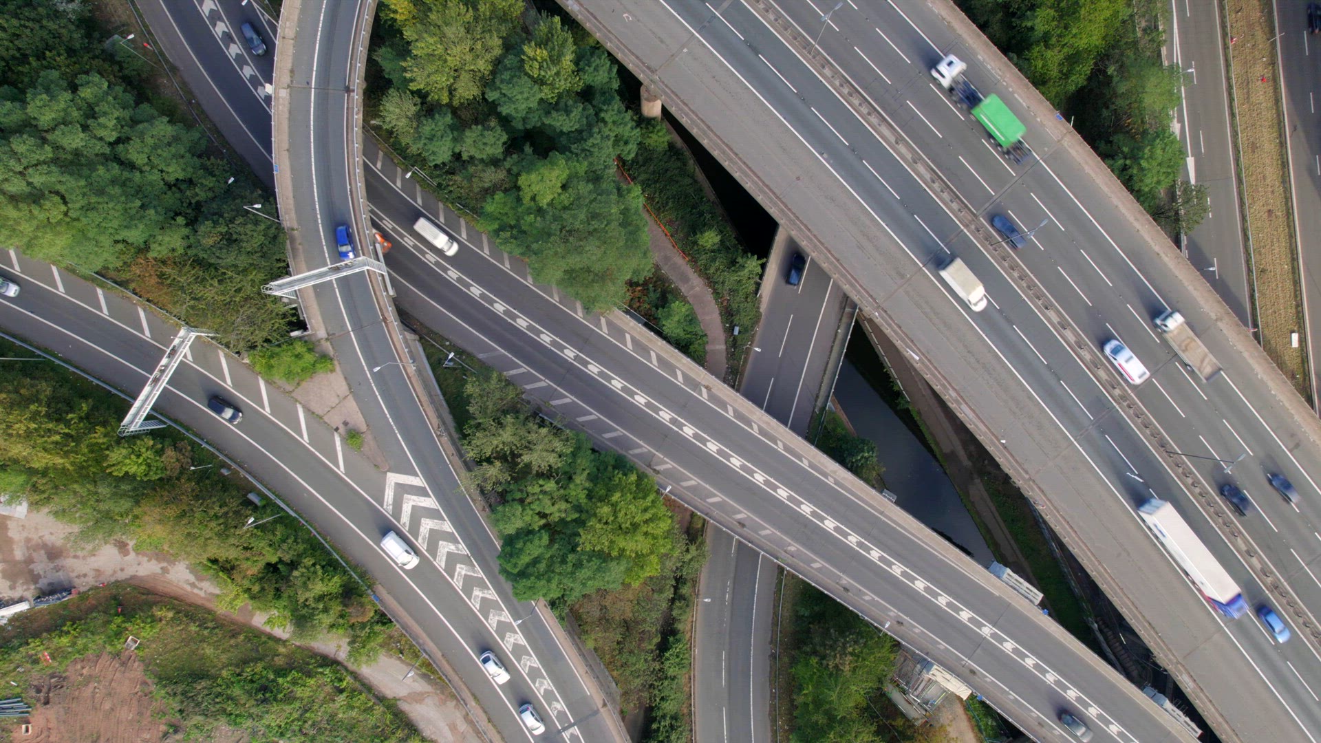 Vehicles Driving Through a Mixing Bowl Interchange Aerial View