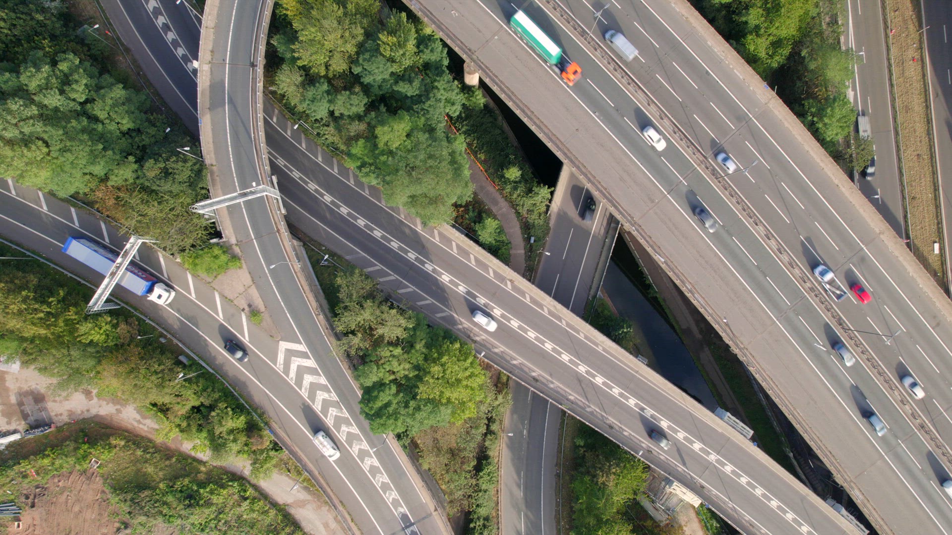 Vehicles Driving on a Mixing Interchange Bird's Eye Aerial View