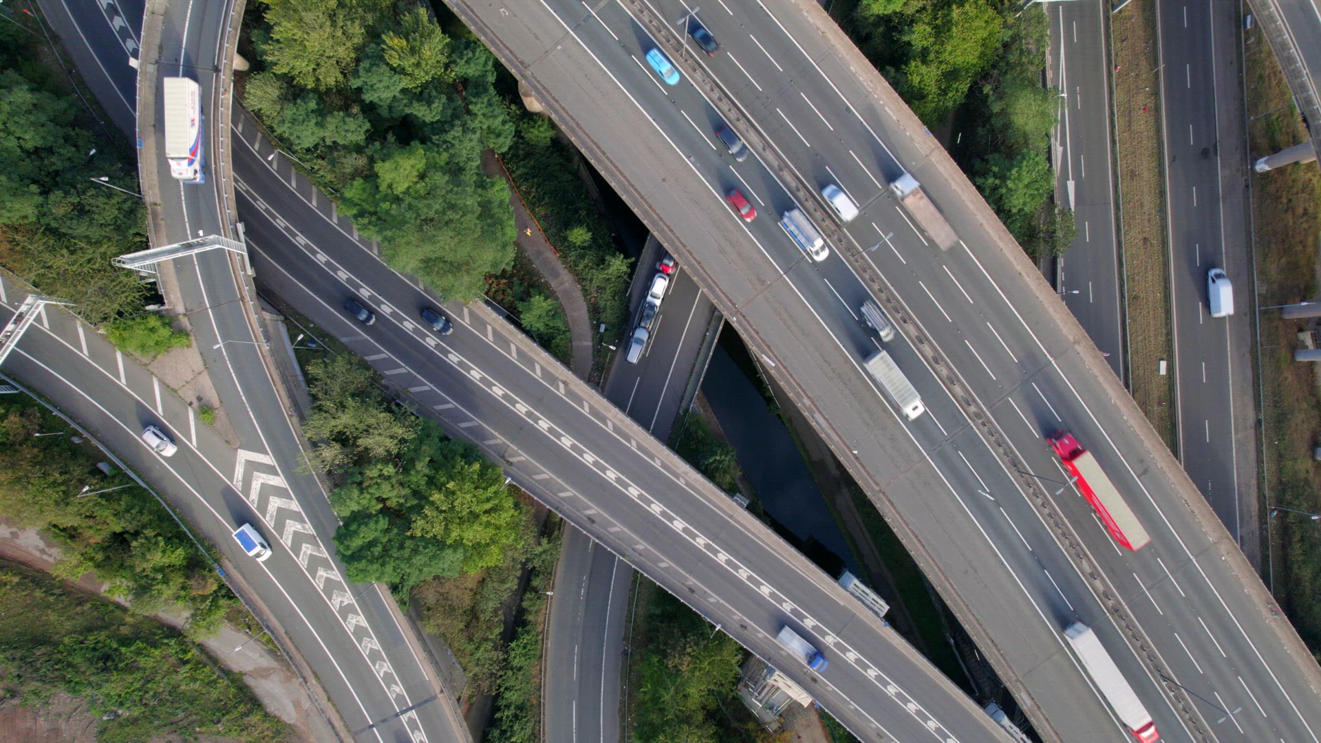 Vehicles Driving Through a Mixing Bowl Interchange Aerial View