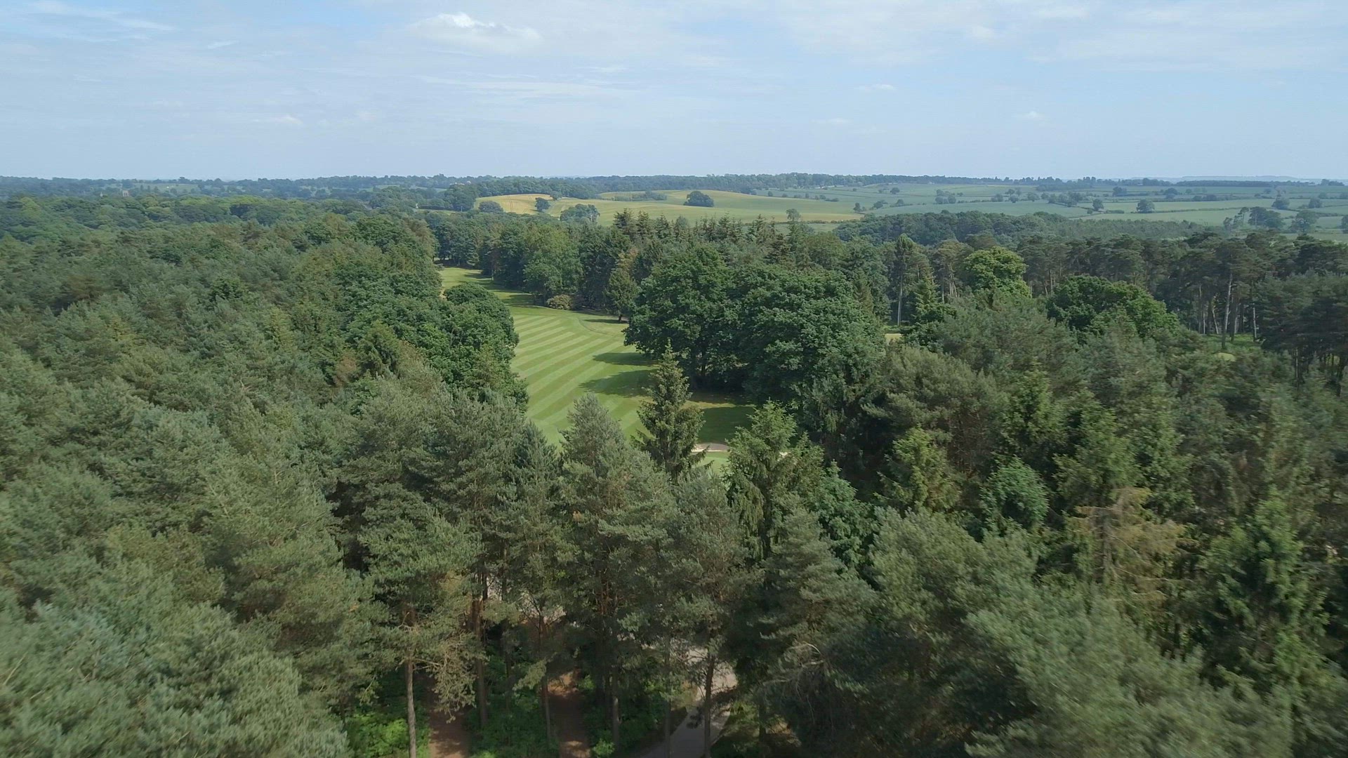 Golfers on the Green of a Golf Course Aerial View