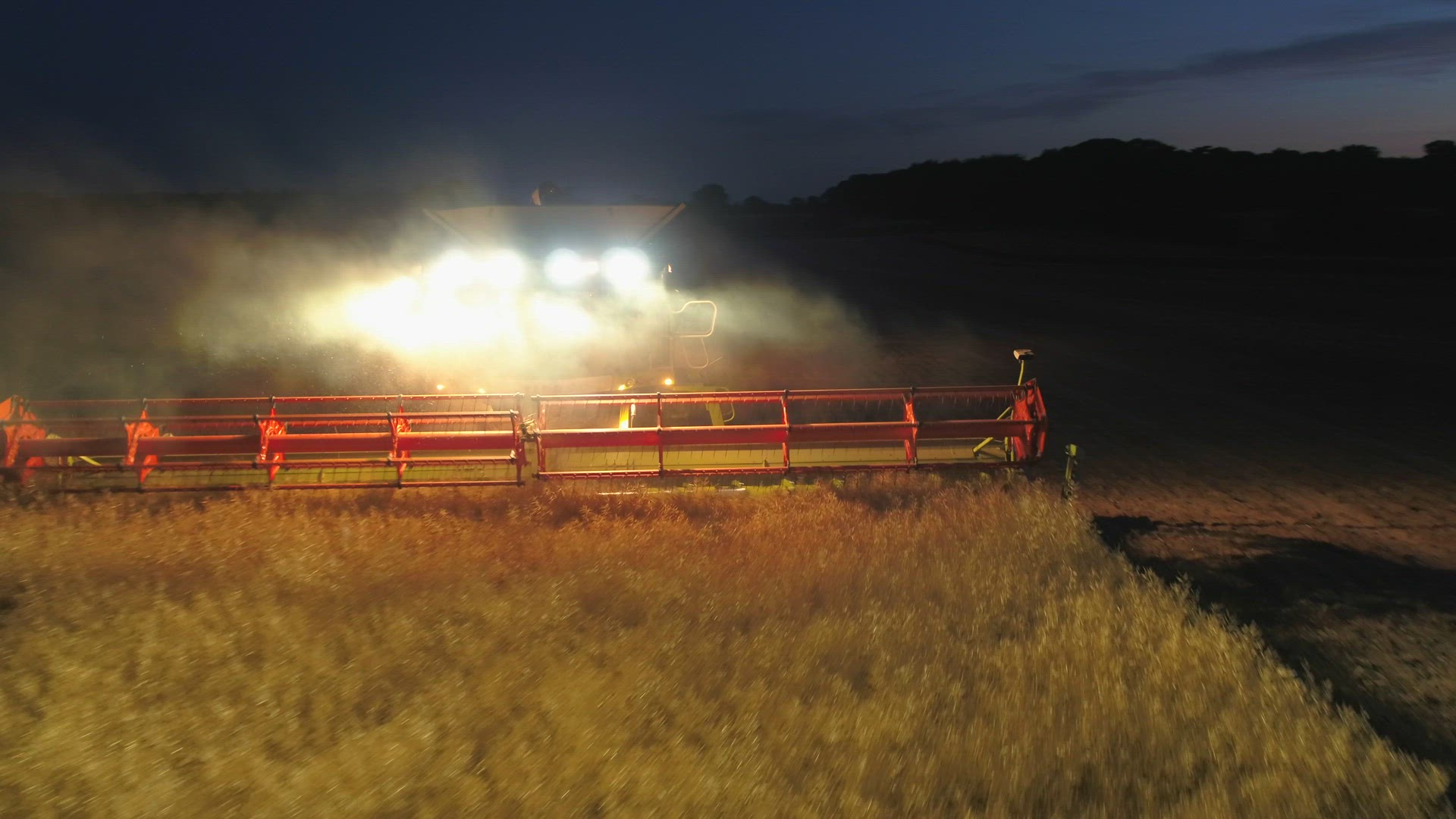 Combine Harvester at Night During the Harvest