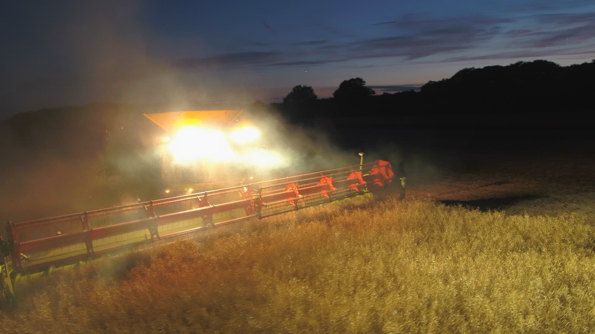 Combine Harvester at Night During the Harvest