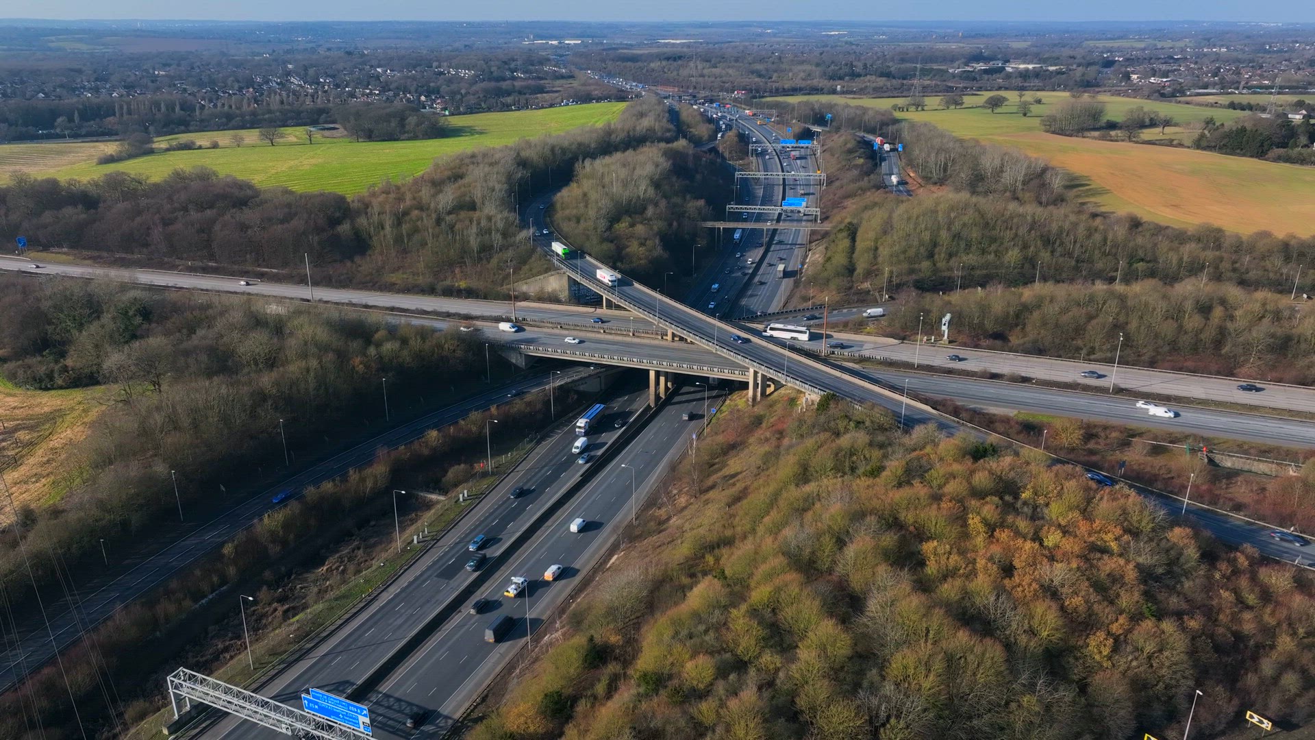 Vehicles at Rush Hour Driving Through a Freeway Intersection Aerial View