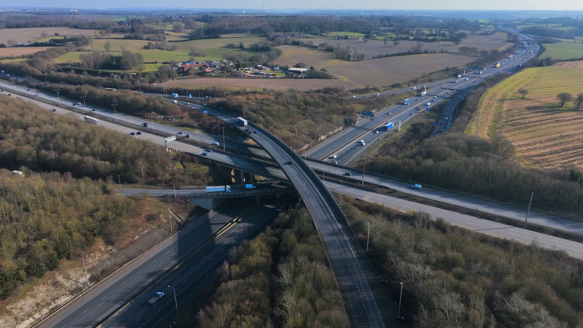 Vehicles at Rush Hour Driving Through a Freeway Intersection Aerial View