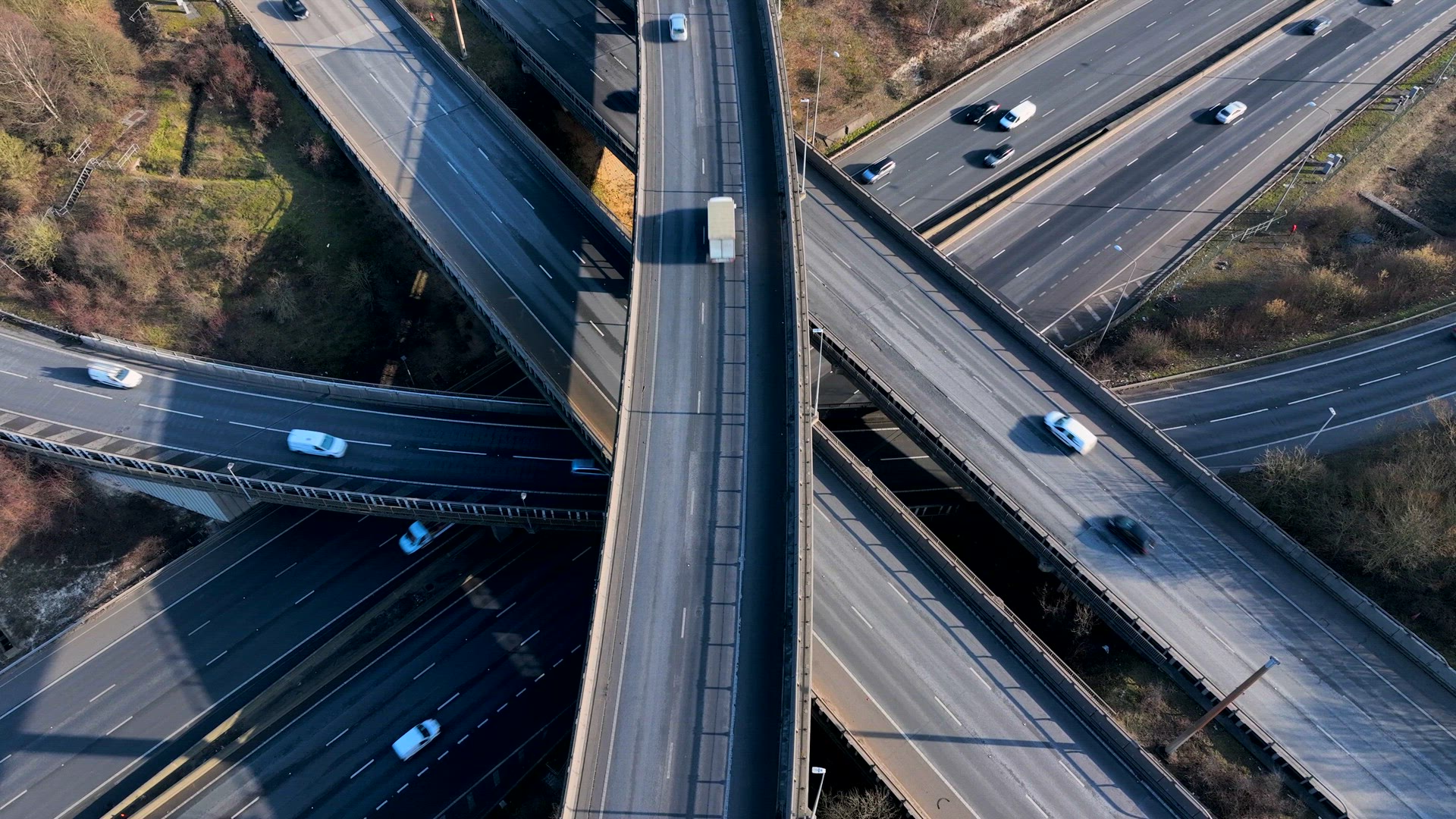 Vehicles at Rush Hour Driving Through a Freeway Intersection Aerial View