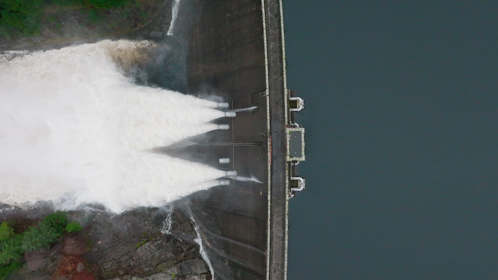 Water Being Pumped Through a Gravity Fed Hydroelectric Power Station Dam