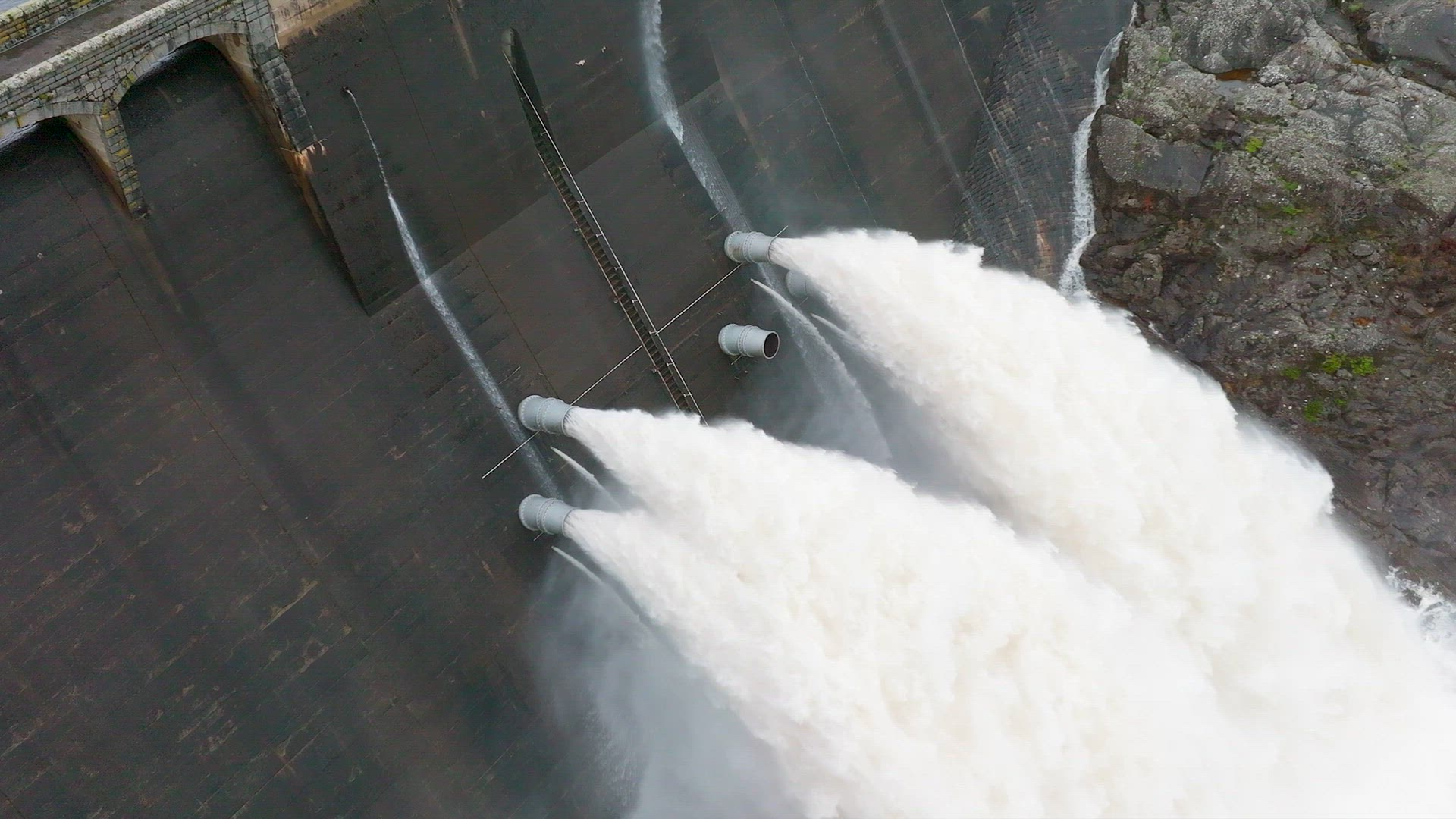 Water Being Pumped Through a Gravity Fed Hydroelectric Power Station Dam