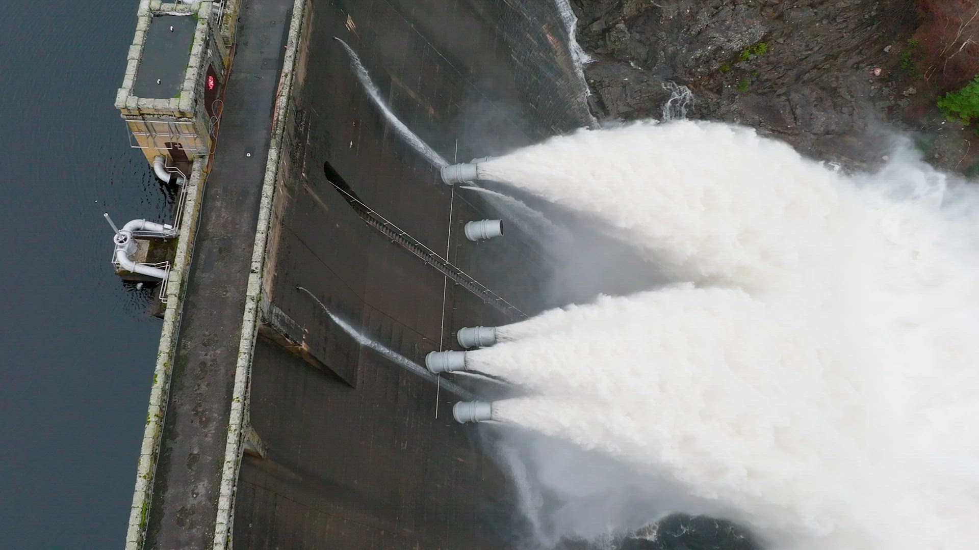 Water Being Pumped Through a Gravity Fed Hydroelectric Power Station Dam