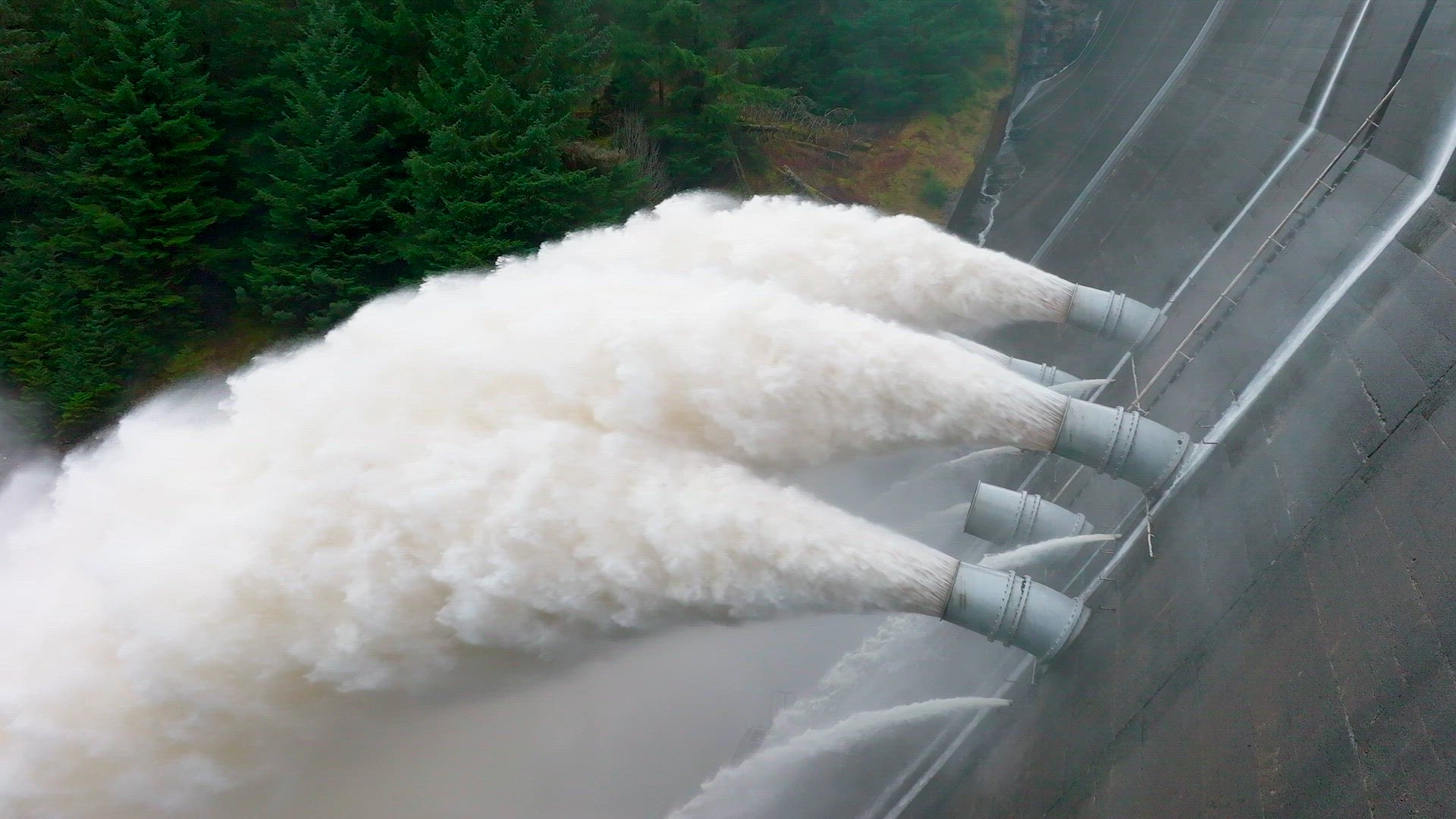 Water Being Pumped Through a Gravity Fed Hydroelectric Power Station Dam