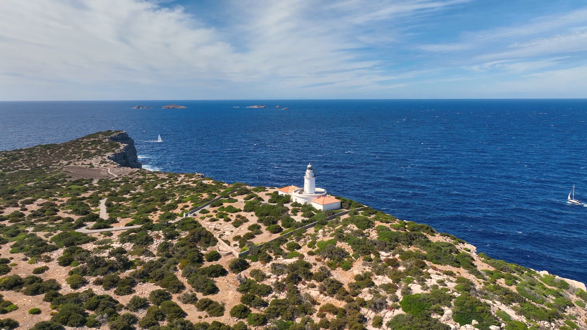 Lighthouse Looking out to Sea on a Cliff in Ibiza