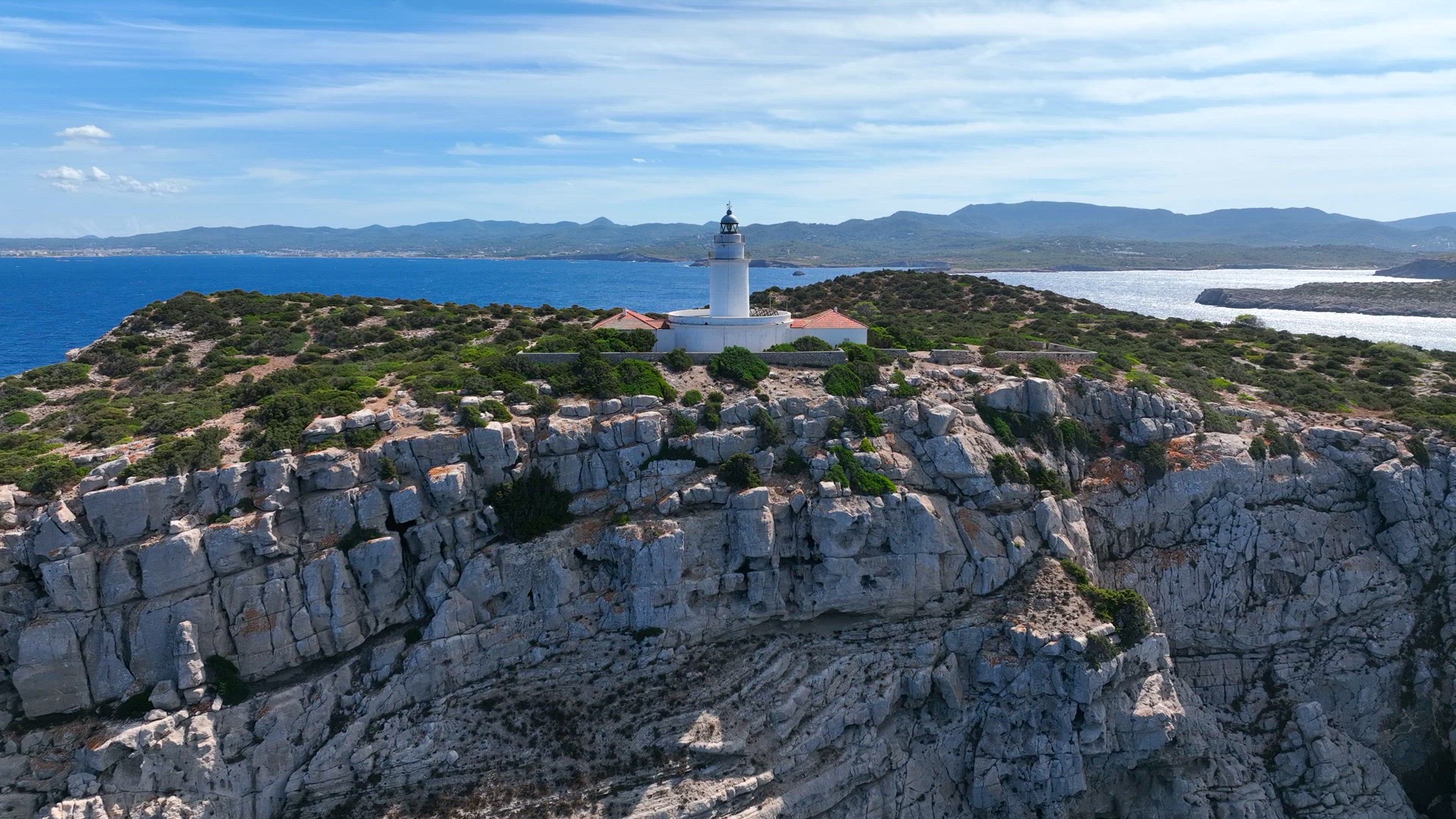 Lighthouse on a Cliff Overlooking the Ocean in Ibiza