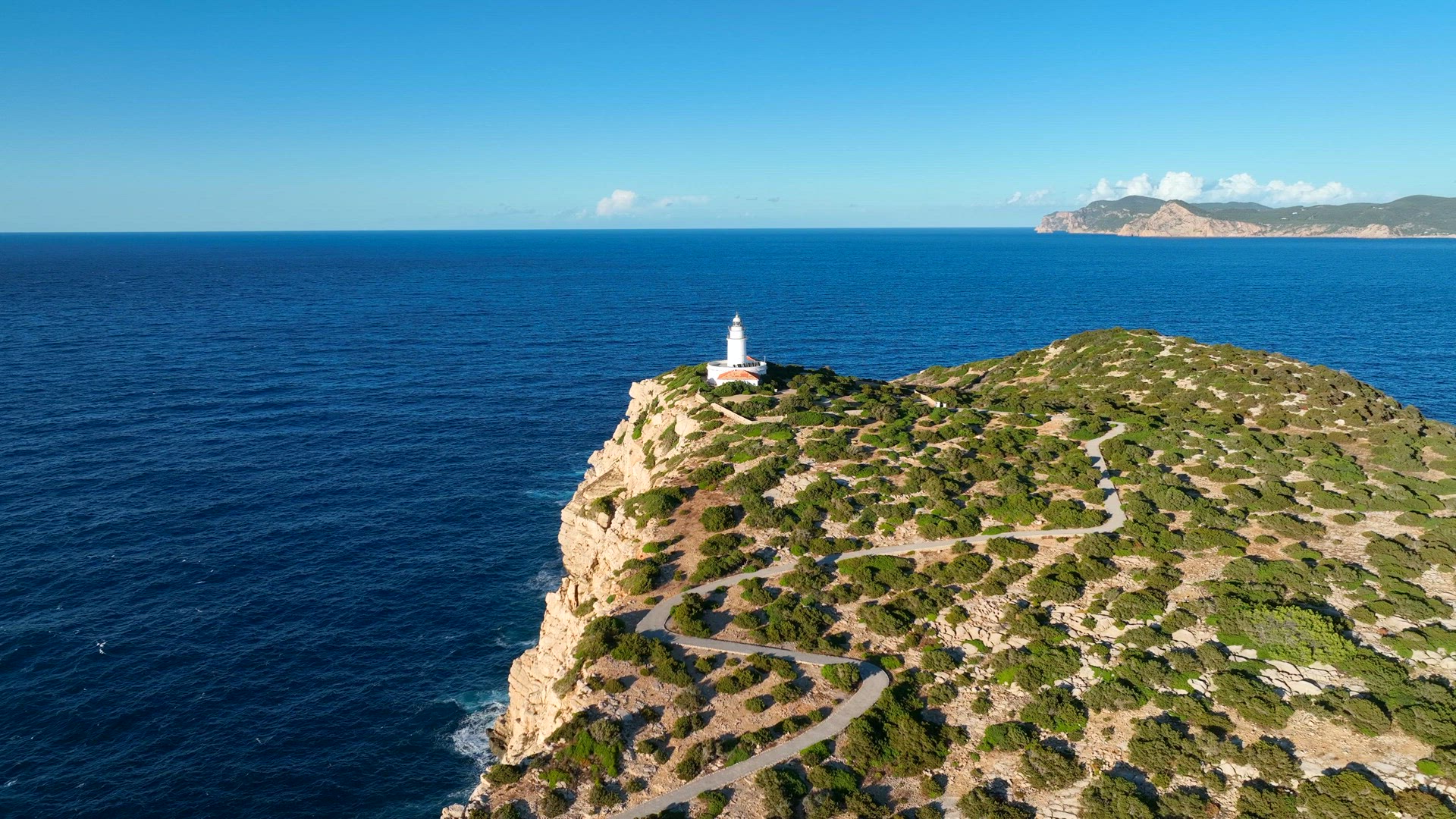 Lighthouse in Ibiza at the Top of a Tall Cliff Aerial View