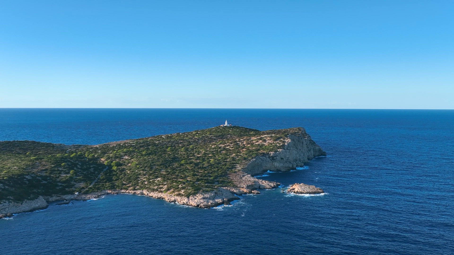 Lighthouse in the Distance on an Island in Ibiza
