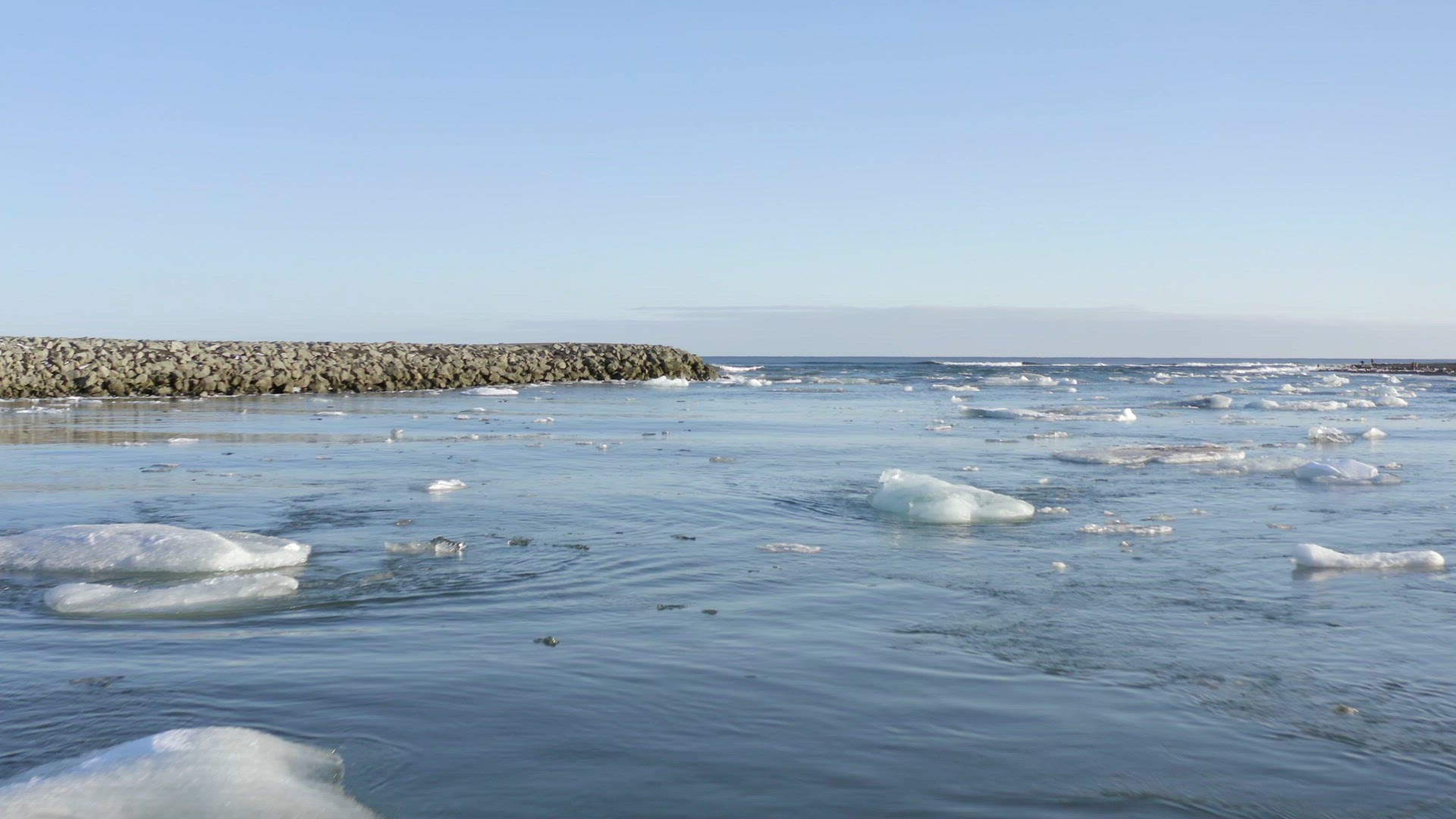 Views From Glacier Lagoon out to Sea with Icebergs in the River and Bridge