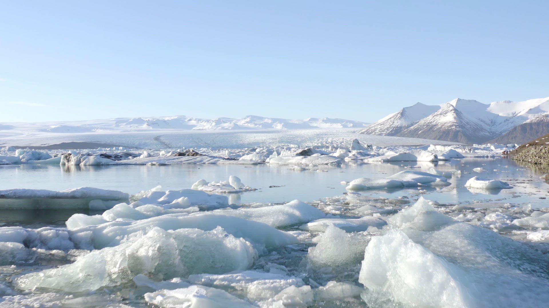 Glacier Lagoon in Iceland Filled With Icebergs Flying Under the Bridge