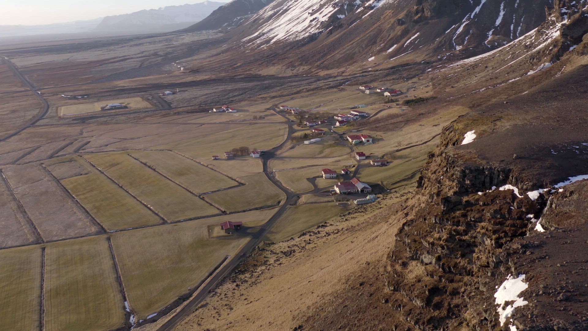 Small Secluded Town Next to a Snowy Mountain in the Winter