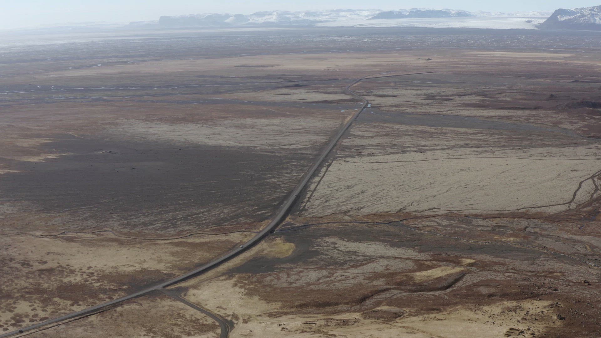 Cars Driving in the Distance Along Baron and Empty Road