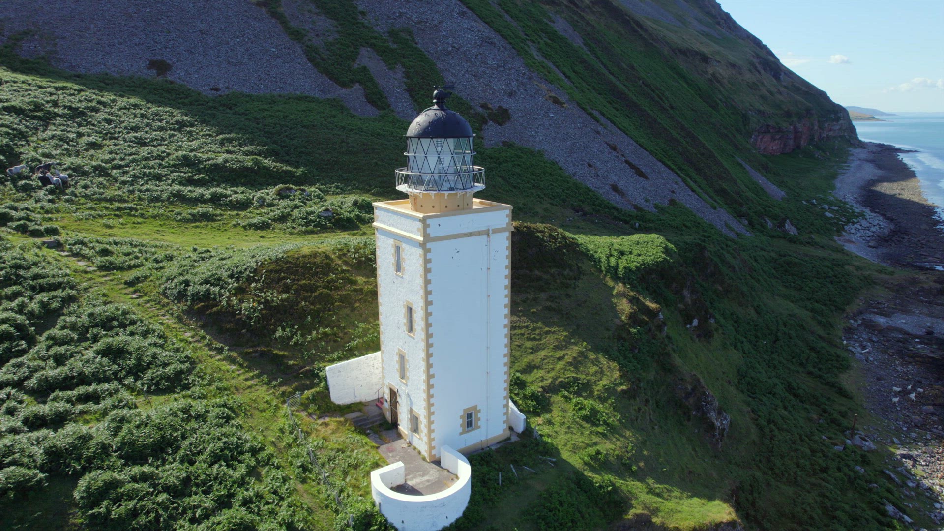 A Beautiful Square Lighthouse on a Cliff in the Summer