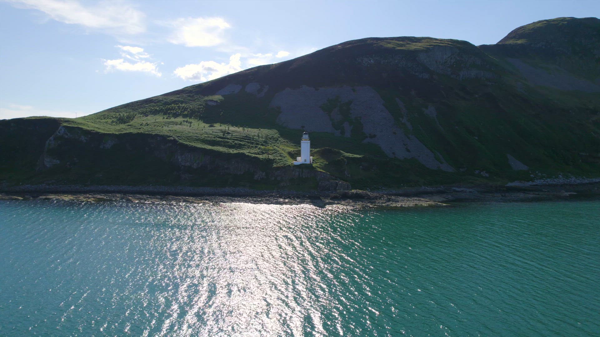 A Square Lighthouse on a Cliff Edge Aerial View