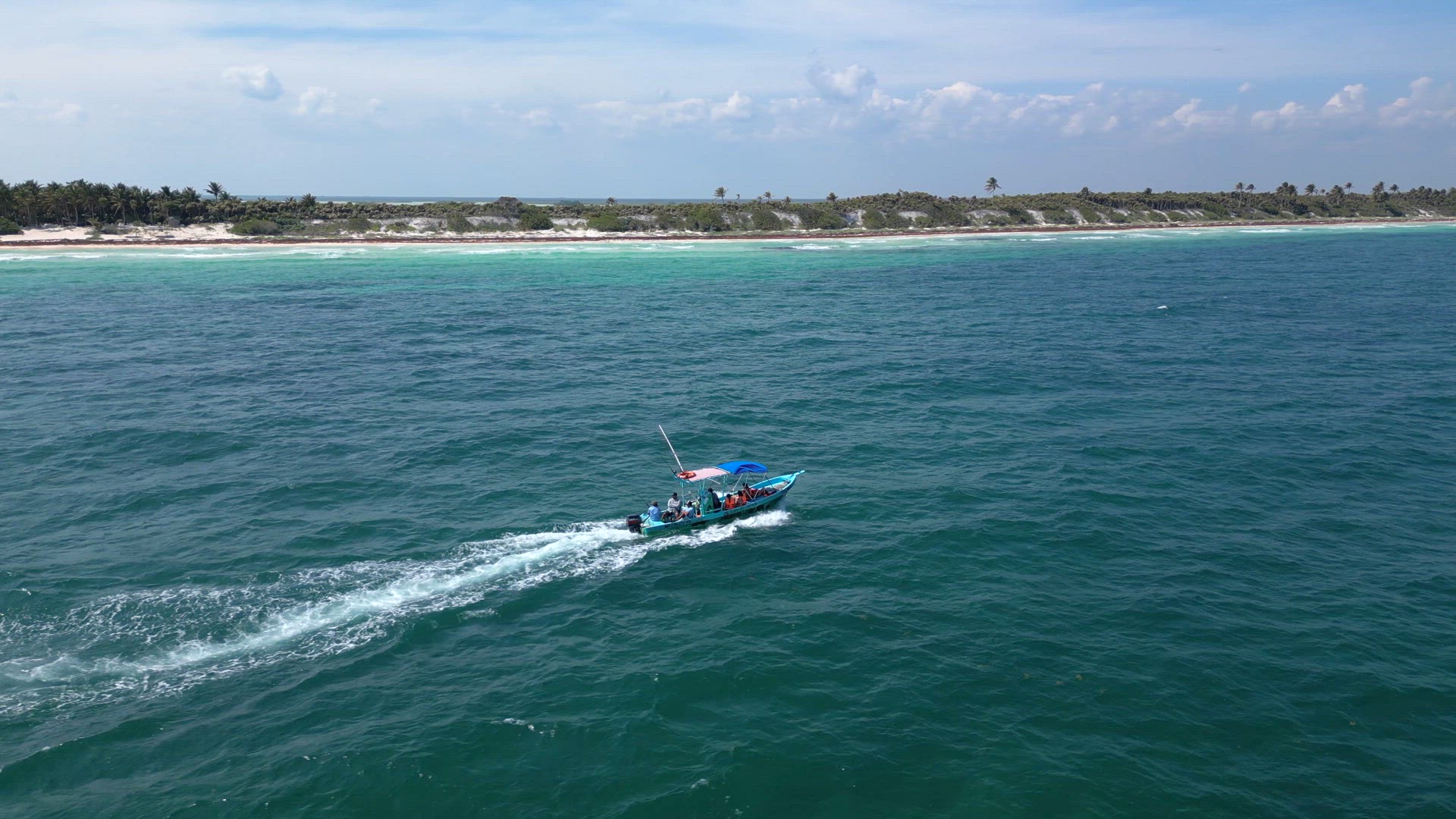 Fishing Tour Boat at Sea Taking Tourists out to Catch Fish in the Caribbean