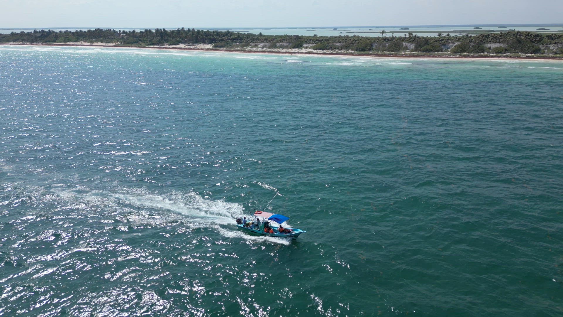 Fishing Tour Boat at Sea Taking Tourists out to Catch Fish in the Caribbean