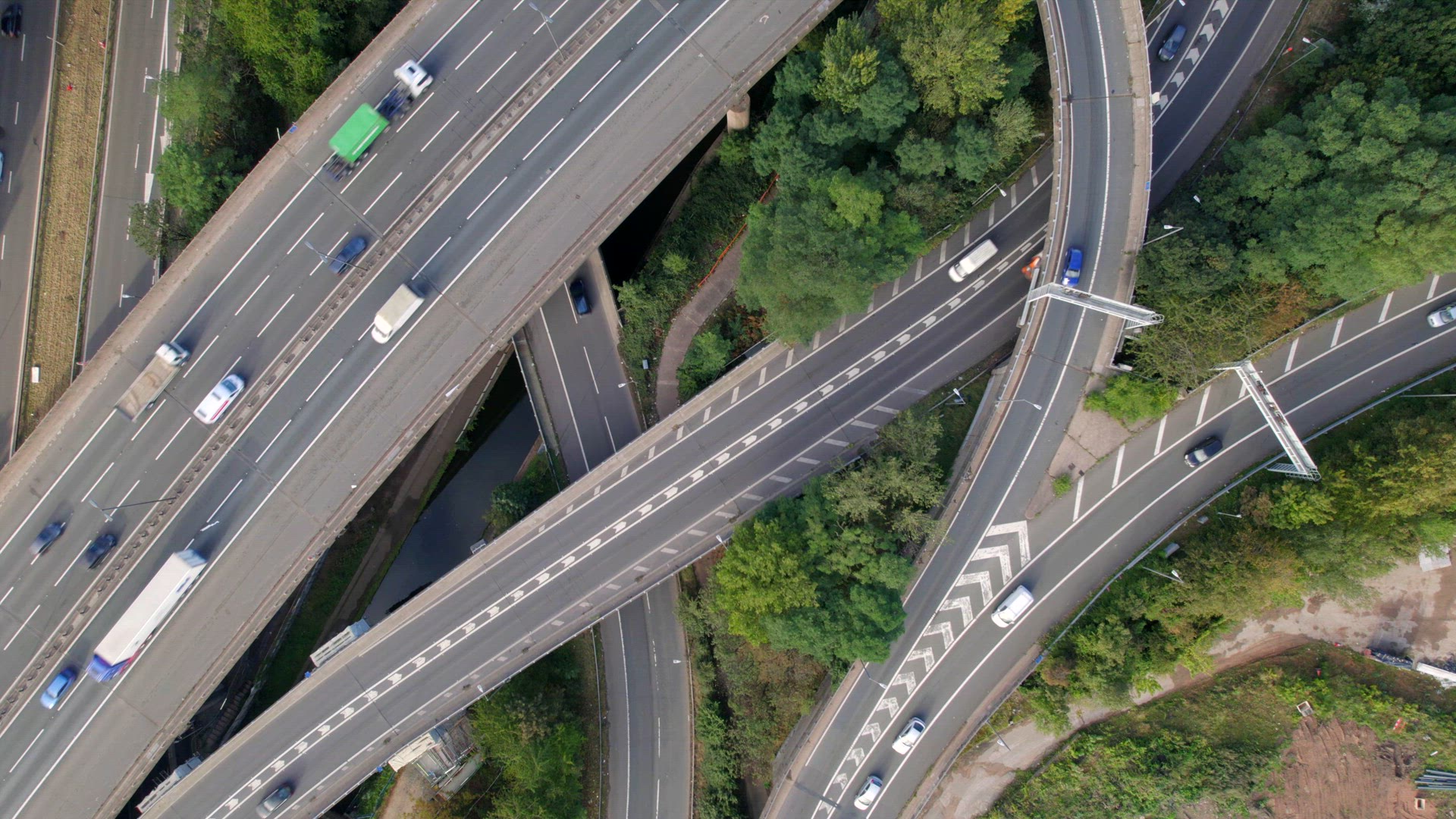 Vehicles Driving on a Spaghetti Interchange Bird's Eye Aerial View