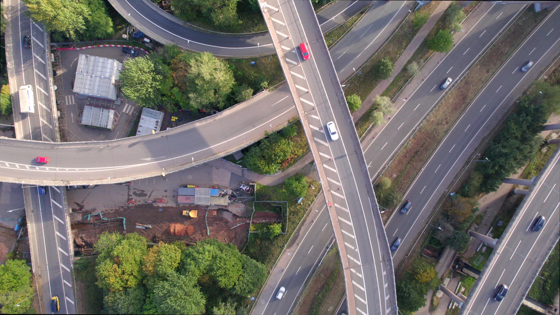 Vehicles Driving on a Spaghetti Interchange Bird's Eye Aerial View