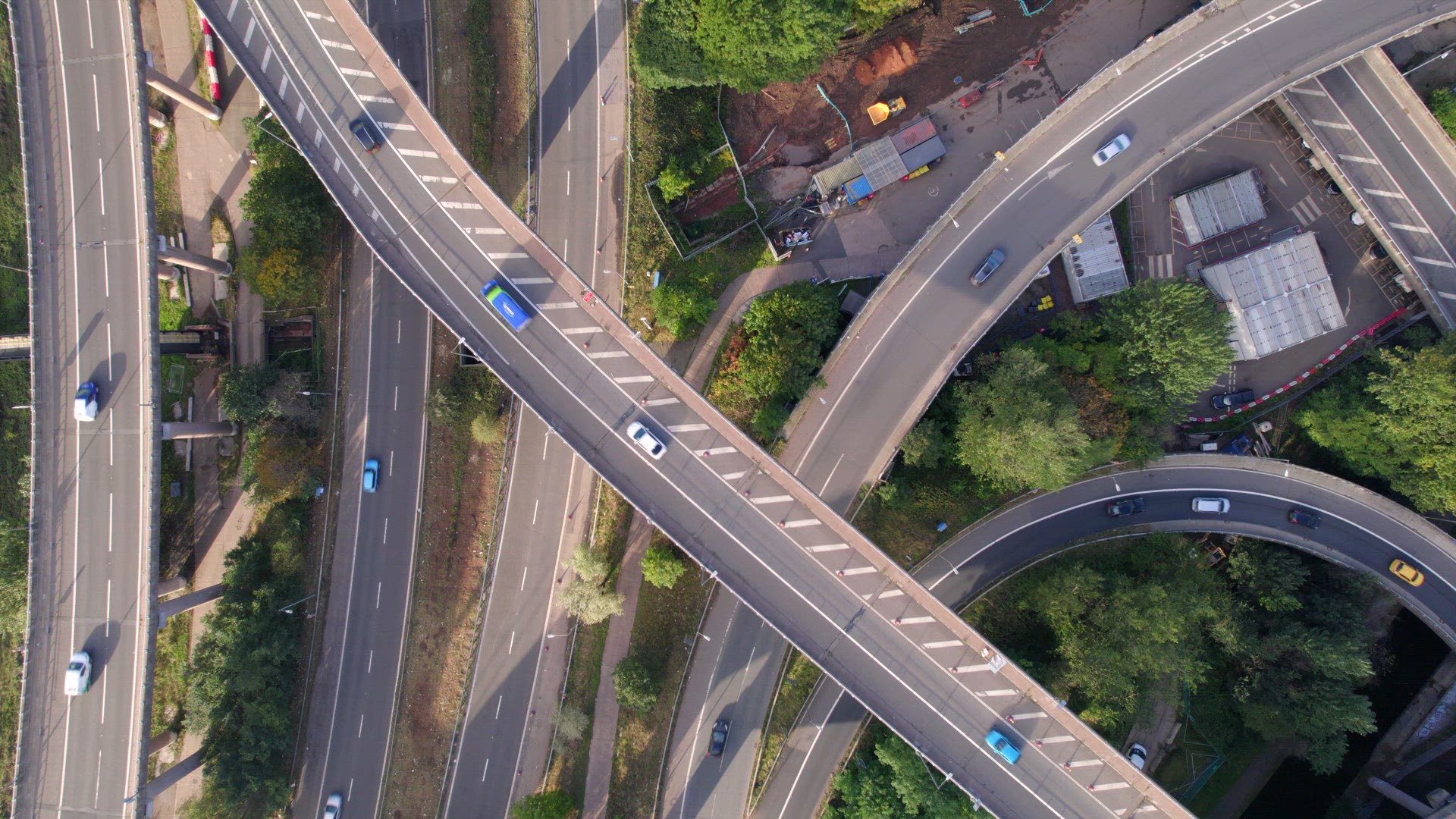 Vehicles Driving on a Spaghetti Interchange Bird's Eye Aerial View